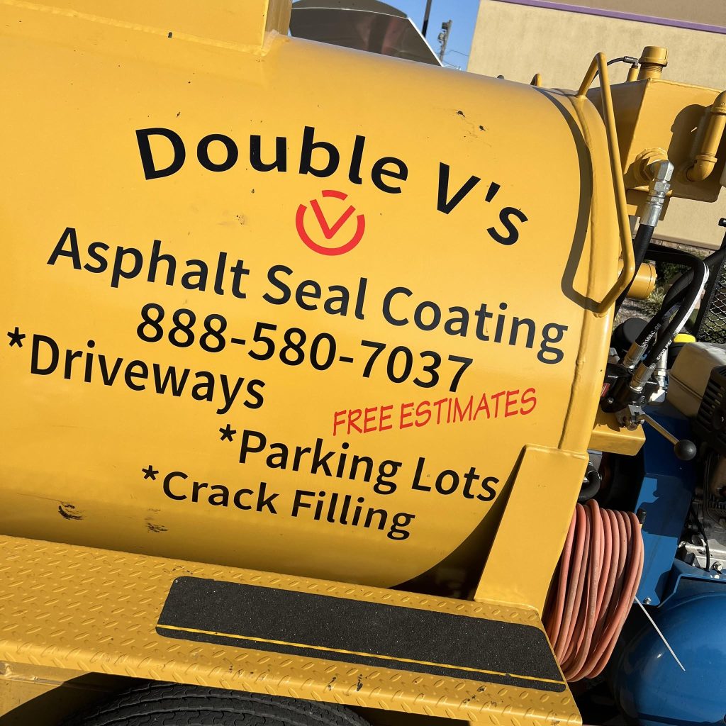 Yellow sealcoating tank bearing Double V's Asphalt Seal Coating branding